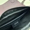 69309d176e68136f4d9ab161 This saddle bag reinterprets the classic design with a modern structure. Crafted from beige and black Oblique printed fabric, it features a signature grained black calfskin magnetic flap and hidden zip closure. The interior includes a spacious compartment and slip pocket for daily essentials. The mini style comes with an adjustable, detachable leather shoulder strap, allowing for handheld, shoulder, or crossbody wear.