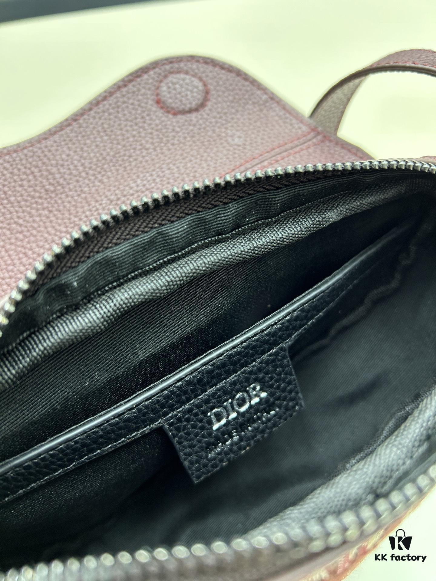69309d176e68136f4d9ab161 This saddle bag reinterprets the classic design with a modern structure. Crafted from beige and black Oblique printed fabric, it features a signature grained black calfskin magnetic flap and hidden zip closure. The interior includes a spacious compartment and slip pocket for daily essentials. The mini style comes with an adjustable, detachable leather shoulder strap, allowing for handheld, shoulder, or crossbody wear.