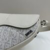 69309d186e68136f4d9ab165 Saddle Bag Reimagined with Modern Structure in Beige and Black Oblique Print