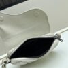 69309d196e68136f4d9ab167 Saddle Bag Reimagined with Modern Structure in Beige and Black Oblique Print