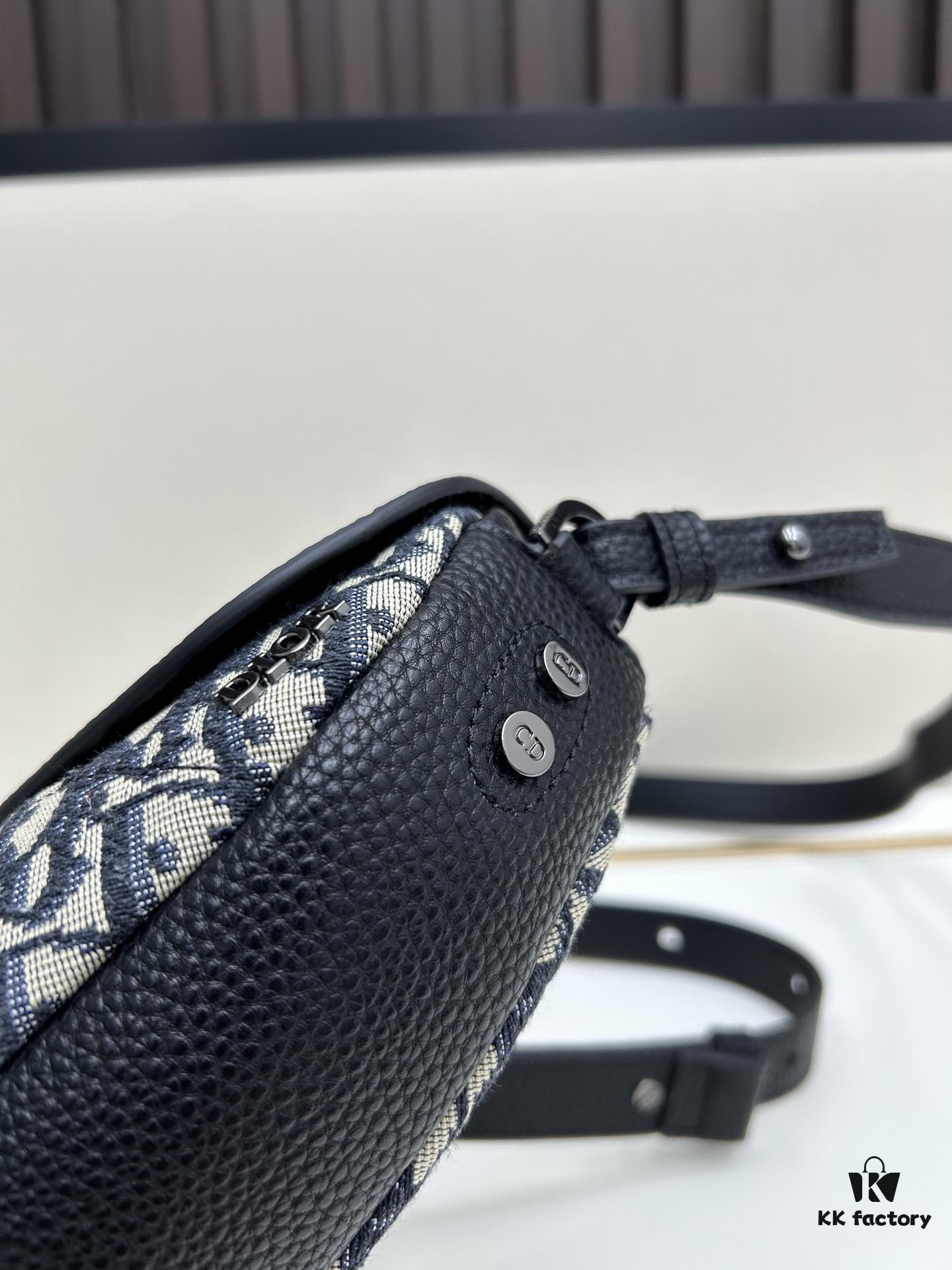 69309d226e68136f4d9ab172 This saddle bag reinterprets the classic design with a modern structure. Crafted from beige and black Oblique printed fabric, it features a signature black grained cowhide leather magnetic flap and a concealed zip closure. The interior includes a large compartment and slip pockets for daily essentials. The mini style comes with an adjustable, detachable leather shoulder strap, allowing versatile wear as a top handle, shoulder bag, or crossbody.