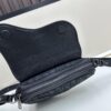 69309d246e68136f4d9ab175 This saddle bag reinterprets the classic design with a modern structure. Crafted from beige and black Oblique printed fabric, it features a signature black grained calfskin magnetic flap and a concealed zip closure. The interior includes a large compartment and slip pockets for organizing daily essentials. This mini style comes with an adjustable and detachable leather shoulder strap, allowing for versatile wear as a handheld, shoulder, or crossbody bag.