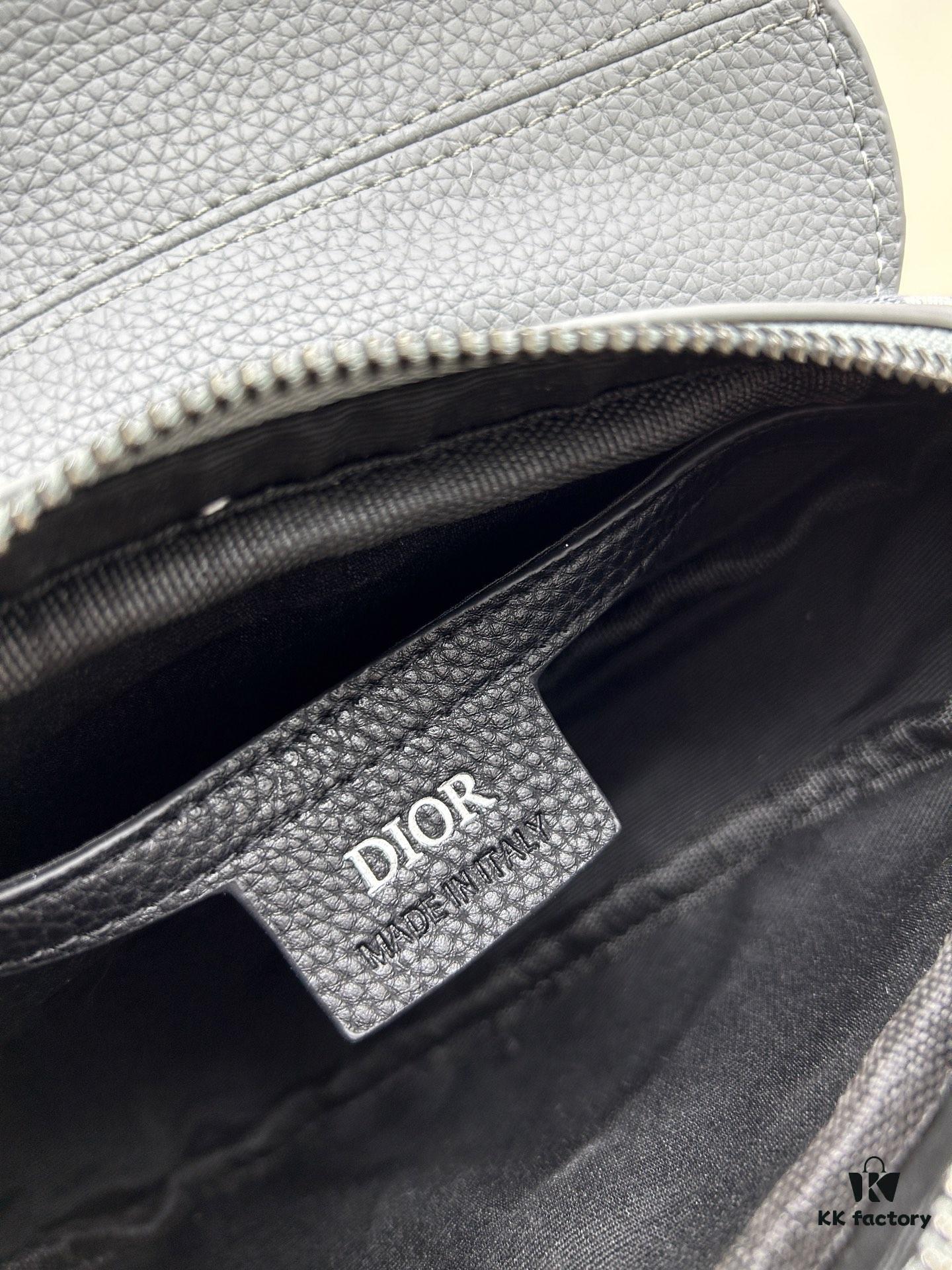 69309d2e6e68136f4d9ab185 This saddle bag reinterprets the classic design with a modern structure. Crafted from beige and black Oblique print fabric, it features a signature black grained calfskin magnetic flap and a concealed zip closure. The interior includes a large compartment and slip pockets for organizing daily essentials. The mini style comes with an adjustable, detachable leather shoulder strap, allowing for handheld, shoulder, or crossbody wear.