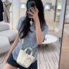 69309e7c6e68136f4d9ab3a5 Dior Toujours Vertical Handbag in Blush Beige Calfskin Leather with Cannage Stitching