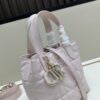 69309e8f6e68136f4d9ab3c6 Dior Toujours Vertical Handbag in Blush Beige Calfskin Leather with Quilted Diamond Stitching