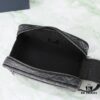 6930a7186e68136f4d9ac463 This toiletry bag combines practical functionality with minimalist design. Crafted from black CD Diamond canvas inspired by the Dior archives, it features smooth calf leather trims in matching tones and a signature Dior emblem on the front.