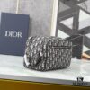 6930a71e6e68136f4d9ac46e This toiletry bag combines practical functionality with minimalist design, crafted in beige and black Oblique printed fabric with black grained leather trims, featuring the Dior logo on the front.