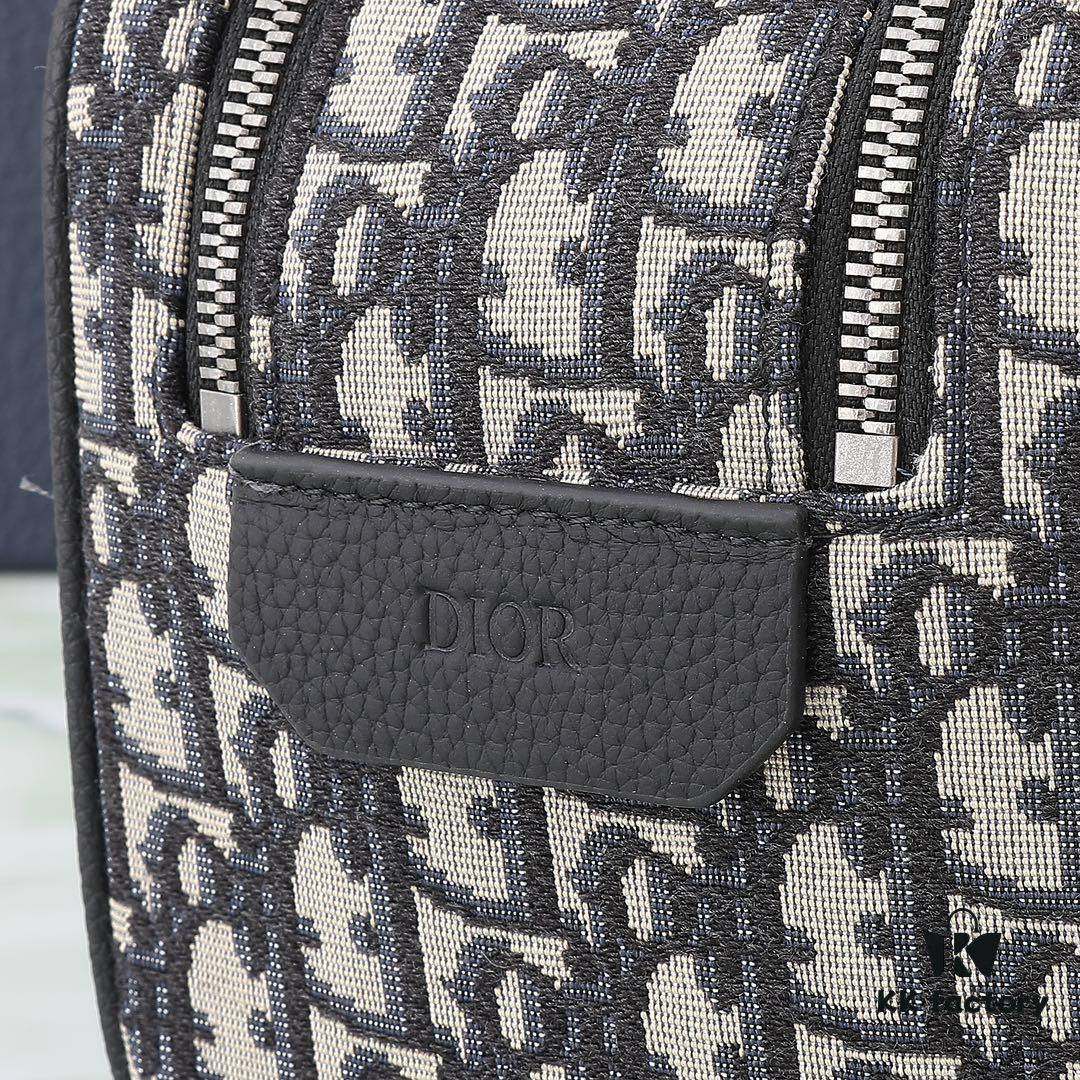 6930a71f6e68136f4d9ac473 This toiletry bag combines practical functionality with minimalist design, crafted in beige and black Oblique printed fabric with black grained leather trims, featuring the Dior logo on the front.