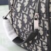 6930a7206e68136f4d9ac475 This toiletry bag combines practical functionality with minimalist design, crafted in beige and black Oblique printed fabric with black grained leather trims, featuring the Dior logo on the front.