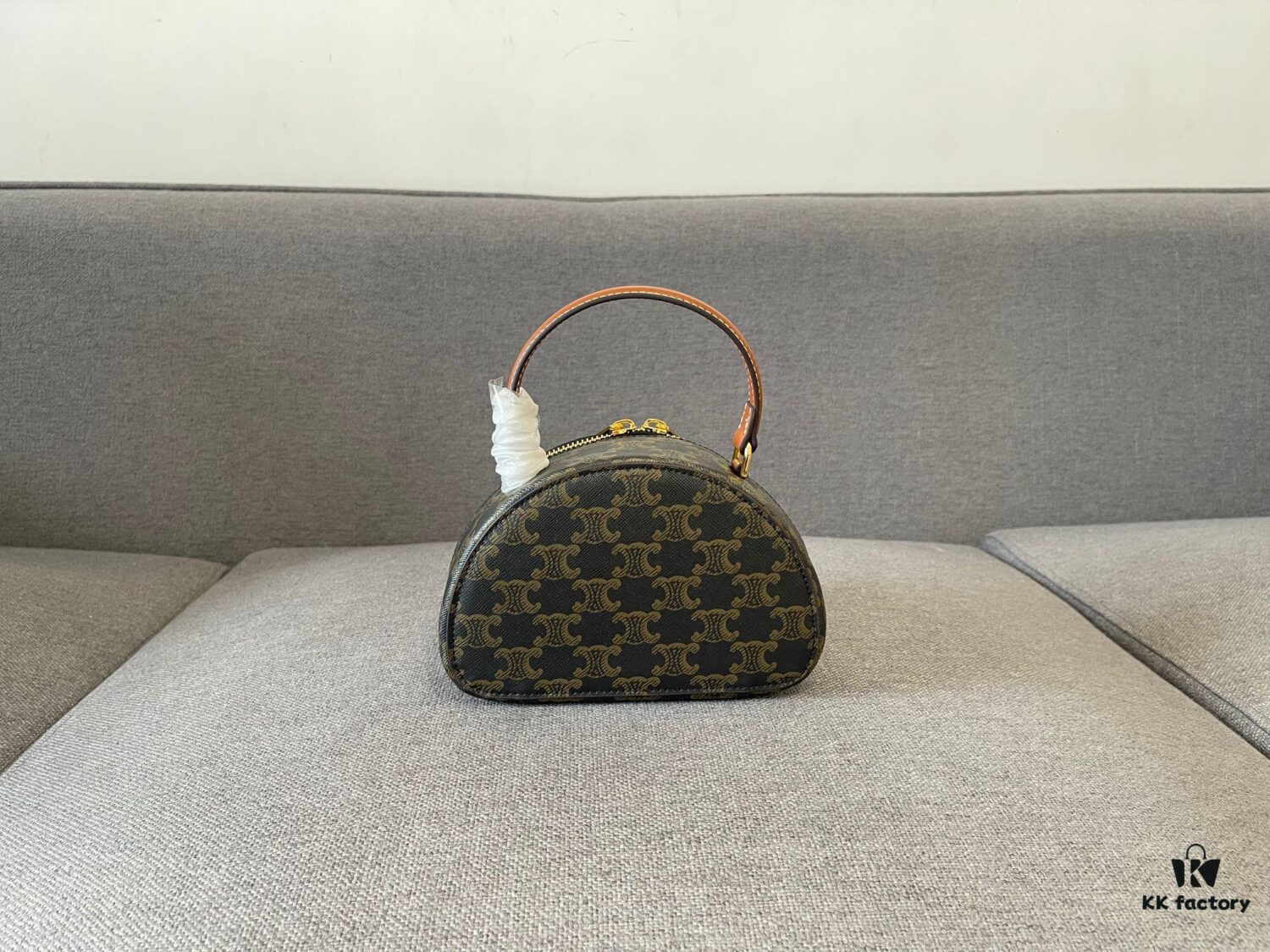 6930ac9f6e68136f4d9aced9 Celine New Logo Print Half-Moon Mini Bag