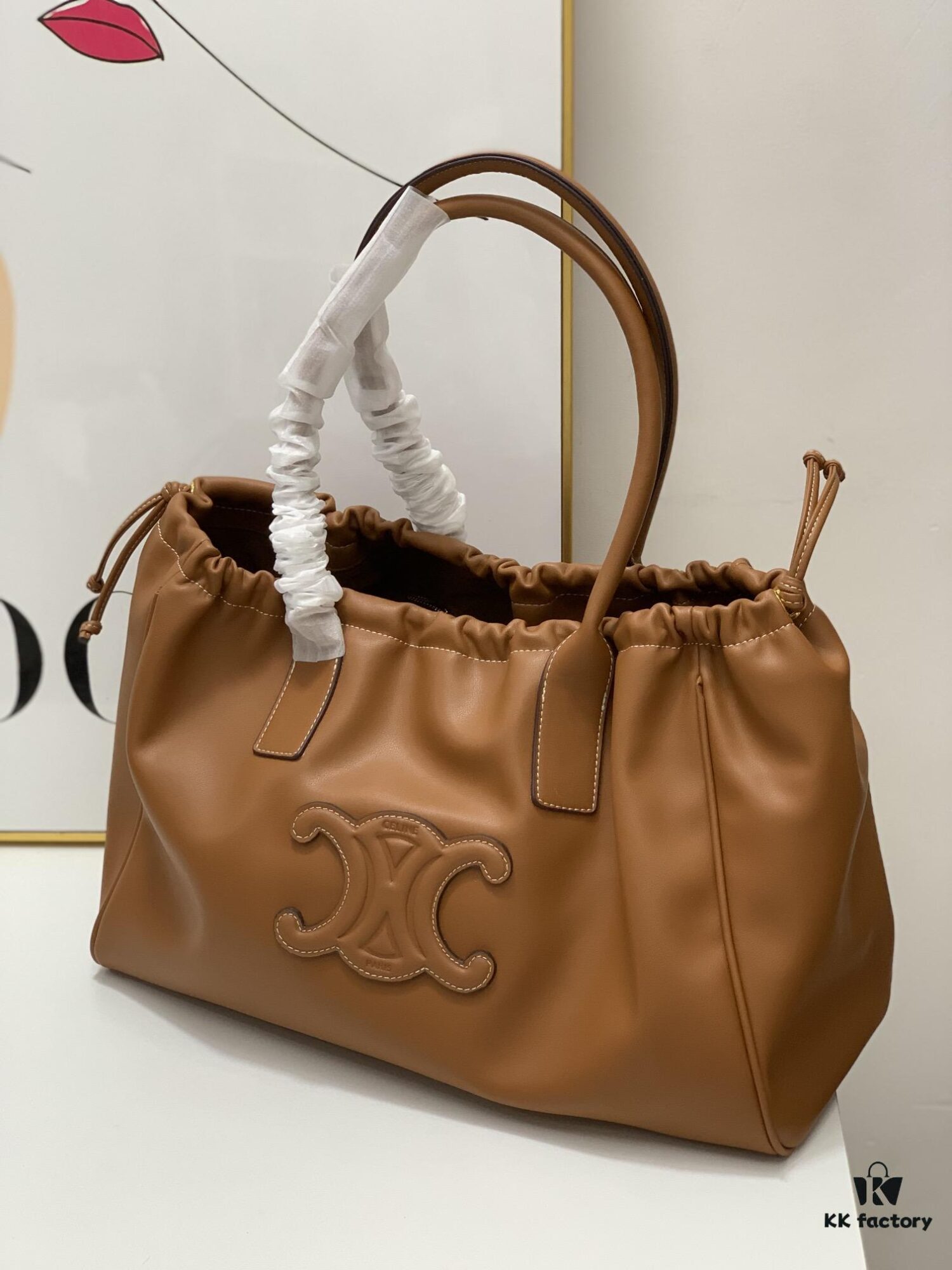 6930af516e68136f4d9ad3e3 Celine New Arrival Tote Bag, Calfskin Material, Arc de Triomphe Embossed Logo, Drawstring Closure at Opening, Adjustable Size
