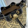 6930afc26e68136f4d9ad4c2 Large TORY BURCH Monogram Drawstring Bucket Bag, Navy Blue Canvas Fabric with Vintage Jacquard Detail, 2021 Summer Collection