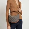 6930b24c6e68136f4d9ad924 Tory Burch Classic Series, New Moon Bag with Signature T-Monogram Pattern