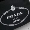 6930b3e96e68136f4d9adb7a Who Could Resist a Prada Beach Bag?