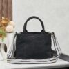 6930b3e96e68136f4d9adb7b Who Could Resist a Prada Beach Bag?