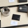 Prada Bestselling Card Holder Unisex Small Wallet Black 1MC025 Diagonal Triangle Pattern Cross-Grain Calfskin Leather 6 Card Slots with Center Compartment