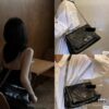 6930b8416e68136f4d9ae334 Prada Re-Edition Nylon Shoulder Bag in Black and Silver – Vintage Charm with Iconic Logo