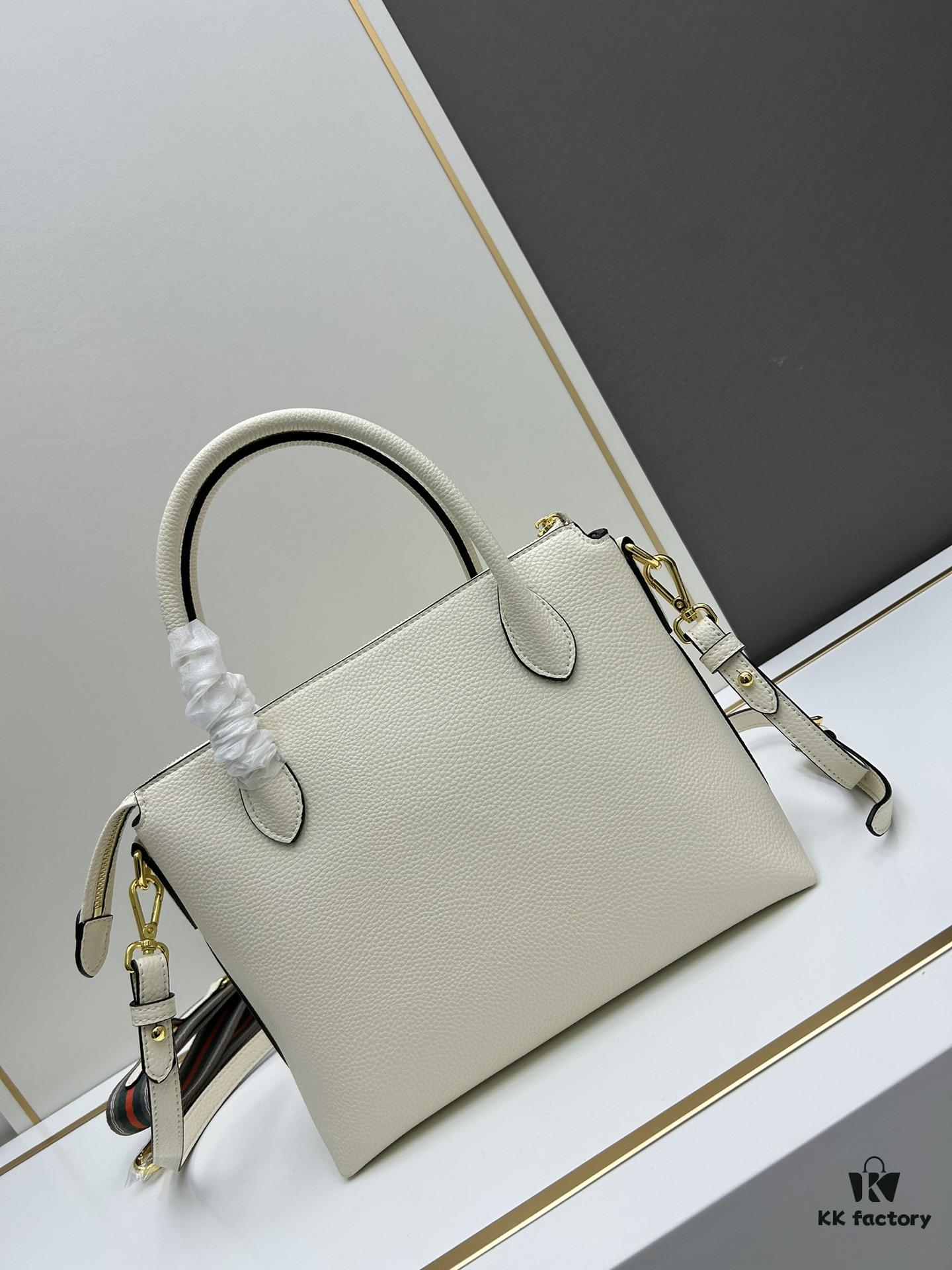 6930b9166e68136f4d9ae4ba PRADA Classic Reissue Leather Bag with Dual Shoulder Straps, Calfskin, Double Top Handles, Removable Adjustable Leather Strap, Removable Adjustable Colorful Fabric Strap, Gold-Tone Hardware, Engraved Metal Logo, Zip Closure, Two Interior Pockets, Jacquard PRADA Logo Lining