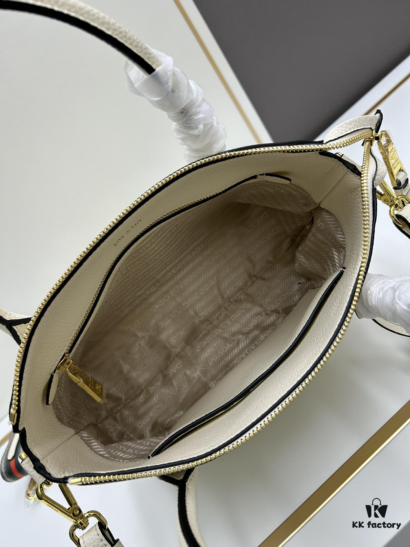6930b91d6e68136f4d9ae4c8 PRADA Classic Reissue Leather Bag with Dual Shoulder Straps, Calfskin, Double Top Handles, Removable Adjustable Leather Strap, Removable Adjustable Colorful Fabric Strap, Gold-Tone Hardware, Engraved Metal Logo, Zip Closure, Two Interior Pockets, Jacquard PRADA Logo Lining