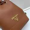 6930b9666e68136f4d9ae536 Prada New Arrival, Calfskin Leather with Pebbled Texture, Comes with Two Shoulder Straps – One Leather Strap and One Colorful Woven Strap for Stylish Versatility