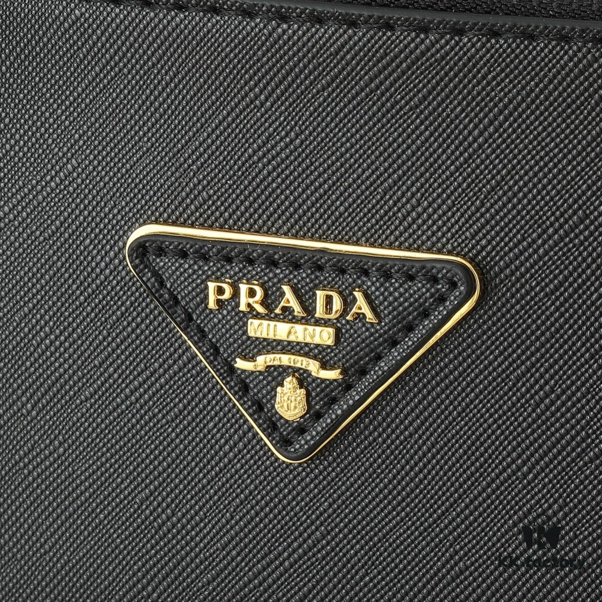 6930b9d96e68136f4d9ae5f8 House Super Hot Killer Bag, Saffiano Leather, Dual Top Handles, Detachable Adjustable Leather Shoulder Strap, Gold-Tone Hardware, Triangle Logo with Metal Lettering on Leather, Snap Button Closure on Side, Two Outer Zip Pockets, Three Interior Pockets Including One with Zipper, Prada-Branded Lining