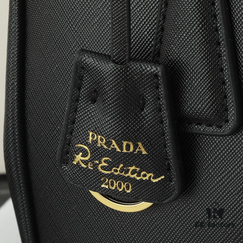 6930b9db6e68136f4d9ae5f9 House Super Hot Killer Bag, Saffiano Leather, Dual Top Handles, Detachable Adjustable Leather Shoulder Strap, Gold-Tone Hardware, Triangle Logo with Metal Lettering on Leather, Snap Button Closure on Side, Two Outer Zip Pockets, Three Interior Pockets Including One with Zipper, Prada-Branded Lining
