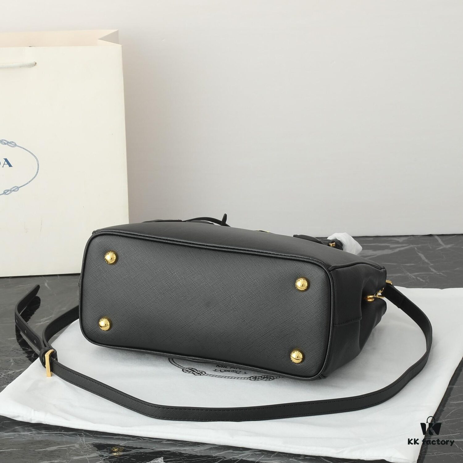 6930b9db6e68136f4d9ae5fa House Super Hot Killer Bag, Saffiano Leather, Dual Top Handles, Detachable Adjustable Leather Shoulder Strap, Gold-Tone Hardware, Triangle Logo with Metal Lettering on Leather, Snap Button Closure on Side, Two Outer Zip Pockets, Three Interior Pockets Including One with Zipper, Prada-Branded Lining