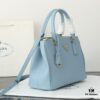 6930b9ea6e68136f4d9ae612 Model 1018 Home Super Hot Killer Bag, Saffiano Leather with Dual Top Handles, Detachable Adjustable Leather Shoulder Strap, Gold-Plated Hardware, Metal Logo Lettering on Triangular Leather Patch, Snap Button Closure on Side, Two Exterior Zip Pockets, Three Interior Pockets Including One Zip Pocket, Prada-Branded Lining