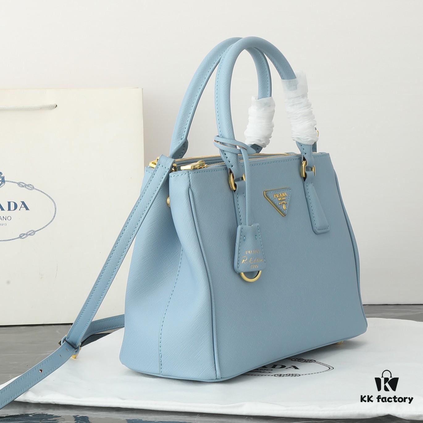 6930b9ea6e68136f4d9ae612 Model 1018 Home Super Hot Killer Bag, Saffiano Leather with Dual Top Handles, Detachable Adjustable Leather Shoulder Strap, Gold-Plated Hardware, Metal Logo Lettering on Triangular Leather Patch, Snap Button Closure on Side, Two Exterior Zip Pockets, Three Interior Pockets Including One Zip Pocket, Prada-Branded Lining
