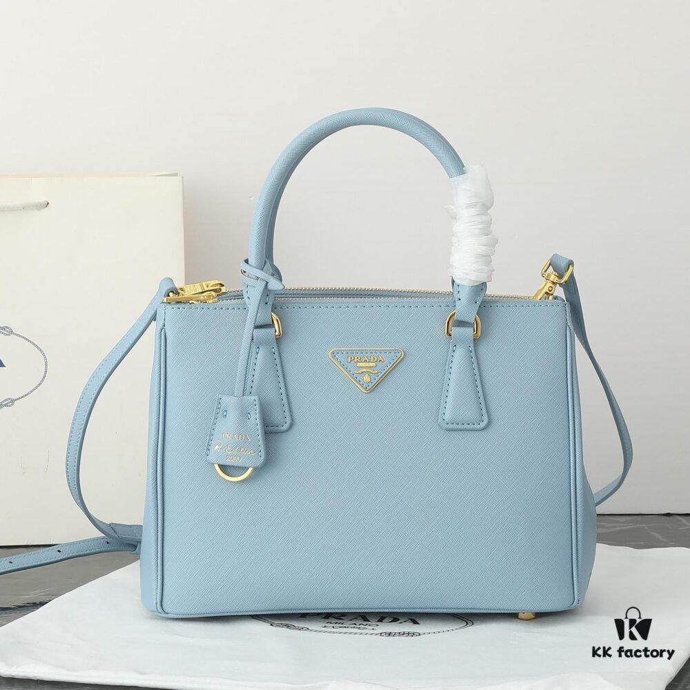 6930b9ea6e68136f4d9ae613 Model 1018 Home Super Hot Killer Bag, Saffiano Leather with Dual Top Handles, Detachable Adjustable Leather Shoulder Strap, Gold-Plated Hardware, Metal Logo Lettering on Triangular Leather Patch, Snap Button Closure on Side, Two Exterior Zip Pockets, Three Interior Pockets Including One Zip Pocket, Prada-Branded Lining