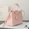 6930b9ef6e68136f4d9ae61a Model 1018 House Super Hot Killer Bag, Saffiano Leather with Dual Top Handles, Detachable Adjustable Leather Shoulder Strap, Gold-Tone Hardware, Metal Logo on Triangular Leather Patch, Snap Button Closure on Side, Two Zippered Outer Pockets, Three Interior Pockets Including One Zippered Compartment, Prada-Branded Lining