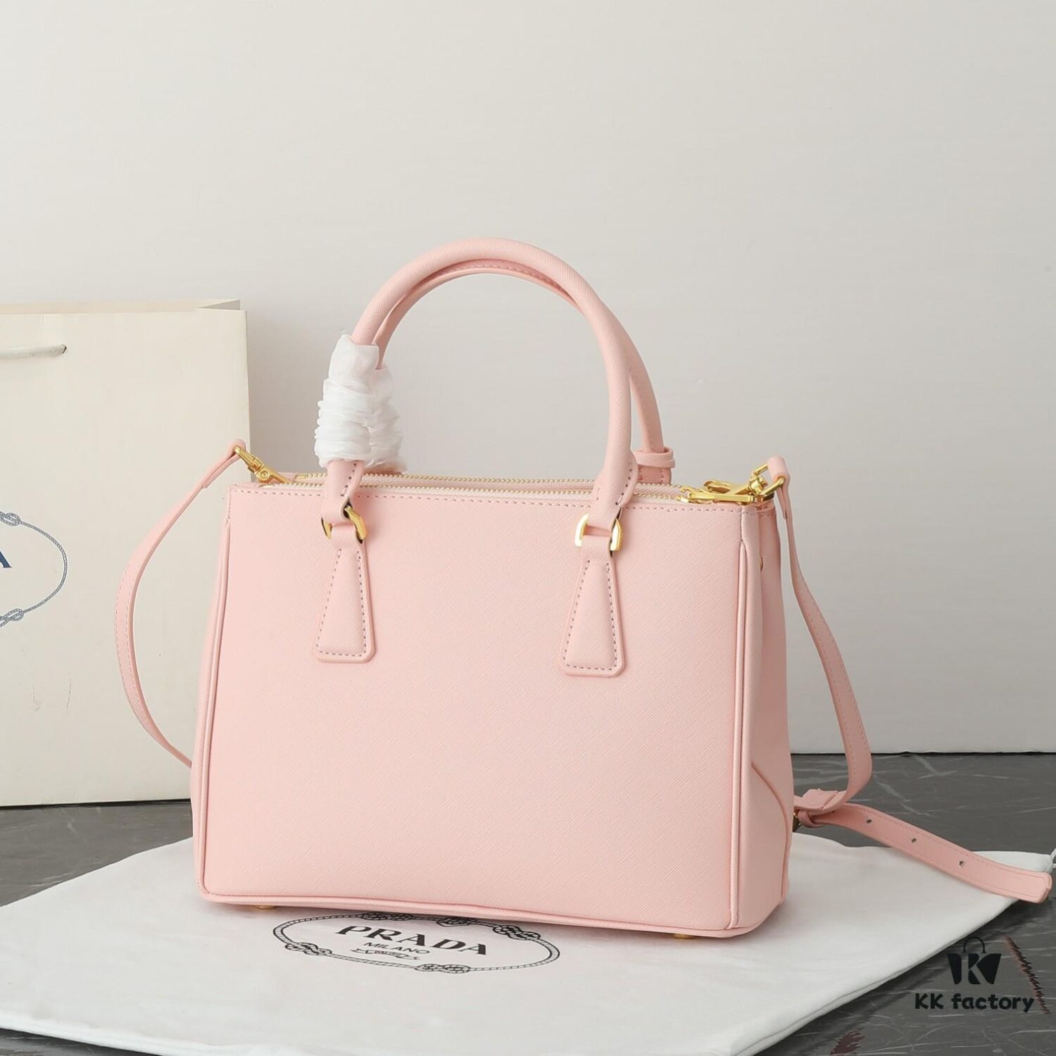 6930b9f36e68136f4d9ae621 Model 1018 House Super Hot Killer Bag, Saffiano Leather with Dual Top Handles, Detachable Adjustable Leather Shoulder Strap, Gold-Tone Hardware, Metal Logo on Triangular Leather Patch, Snap Button Closure on Side, Two Zippered Outer Pockets, Three Interior Pockets Including One Zippered Compartment, Prada-Branded Lining