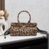 6930c0d16e68136f4d9af18c Prada Holidays ✨ This year's Holiday collection is absolutely stunning! The new leopard-print horsehair material on the best-selling bag design embodies wild elegance. The classic lamb wool and black velvet styles are must-have pieces for the holiday season.