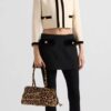 6930c0fe6e68136f4d9af1da Prada Holidays ✨||| This year's Holiday collection is absolutely stunning—featuring the new leopard-print pony hair version of the best-selling bag, a wild expression of boldness. The classic lamb fur and black velvet styles remain must-have pieces for holiday season essentials.