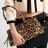 6930c1006e68136f4d9af1dc Prada Holidays ✨||| This year's Holiday collection is absolutely stunning—featuring the new leopard-print pony hair version of the best-selling bag, a wild expression of boldness. The classic lamb fur and black velvet styles remain must-have pieces for holiday season essentials.