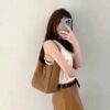 6930cb916e68136f4d9b0387 New YSL Shoulder Bag, Soft and Stylish in Black and Caramel