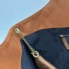 6930cf5b6e68136f4d9b09c7 New YSL Saint Laurent Suede Icare Quilted Tote Bag in Black and Caramel