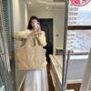 6930cf5c6e68136f4d9b09c8 New YSL Oversized Logo Quilted Tote Bag