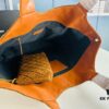 6930d0f06e68136f4d9b0c30 New YSL Icare Suede Quilted Tote Bag in Black and Caramel
