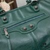 6930da866e68136f4d9b1a16 Streetwear Statement! Balenciaga Motorcycle Bag with Studs