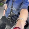 6930e0e56e68136f4d9b226d Balenciaga LE CAGOLE MEDIUM BUM BAG IN BLACK TEXTURED LAMB LEATHER