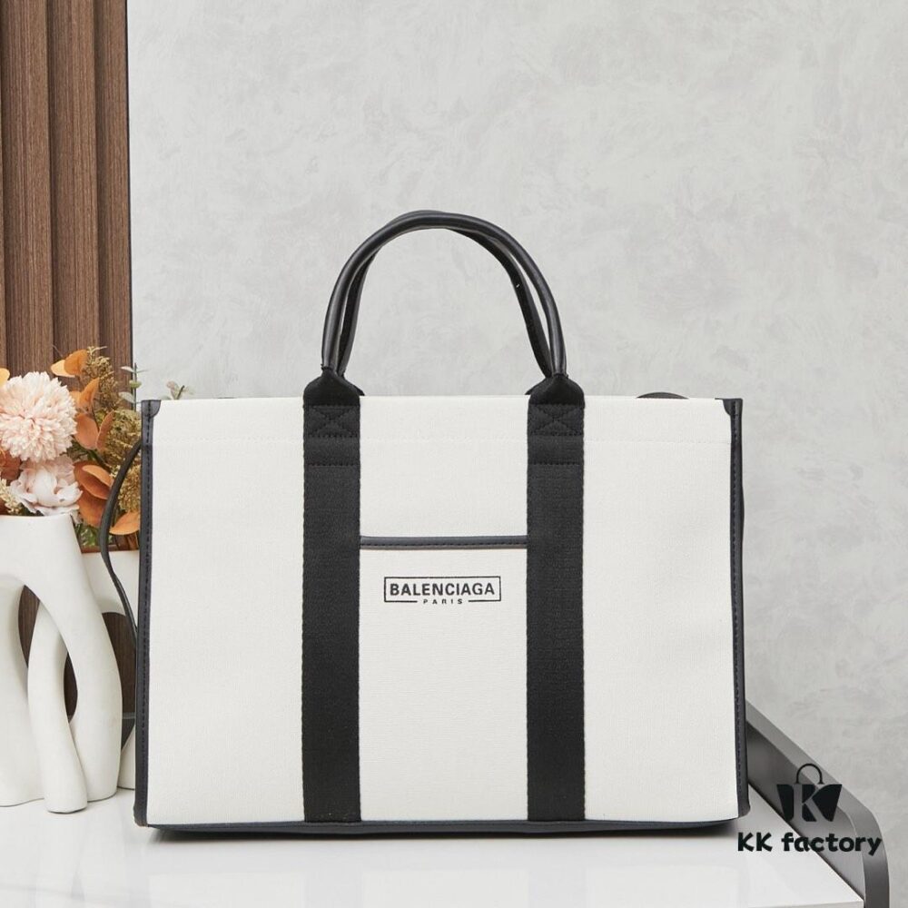 6930e17b6e68136f4d9b2328 Large Balenciaga Hardware Tote – A modern interpretation of a canvas bag originally developed for the Marine Corps