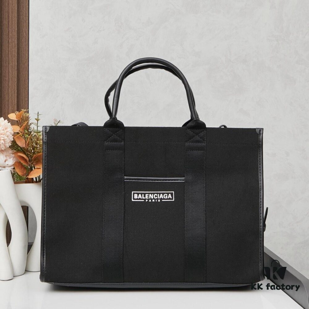 6930e1826e68136f4d9b2335 Large Balenciaga Hardware Tote – A modern interpretation of a canvas bag originally developed for the Marine Corps