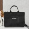 6930e1826e68136f4d9b2335 Large Balenciaga Hardware Tote – A modern interpretation of a canvas bag originally developed for the Marine Corps