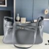 6930e1b36e68136f4d9b236c New Balenciaga Winter 24 Collection Re-See Shoulder Bucket Bag, Full-Grain Leather, Minimalist Luxury Design, Upcycled Motorbike Glove Clutch with Keychain Closure, Effortlessly Chic Look
