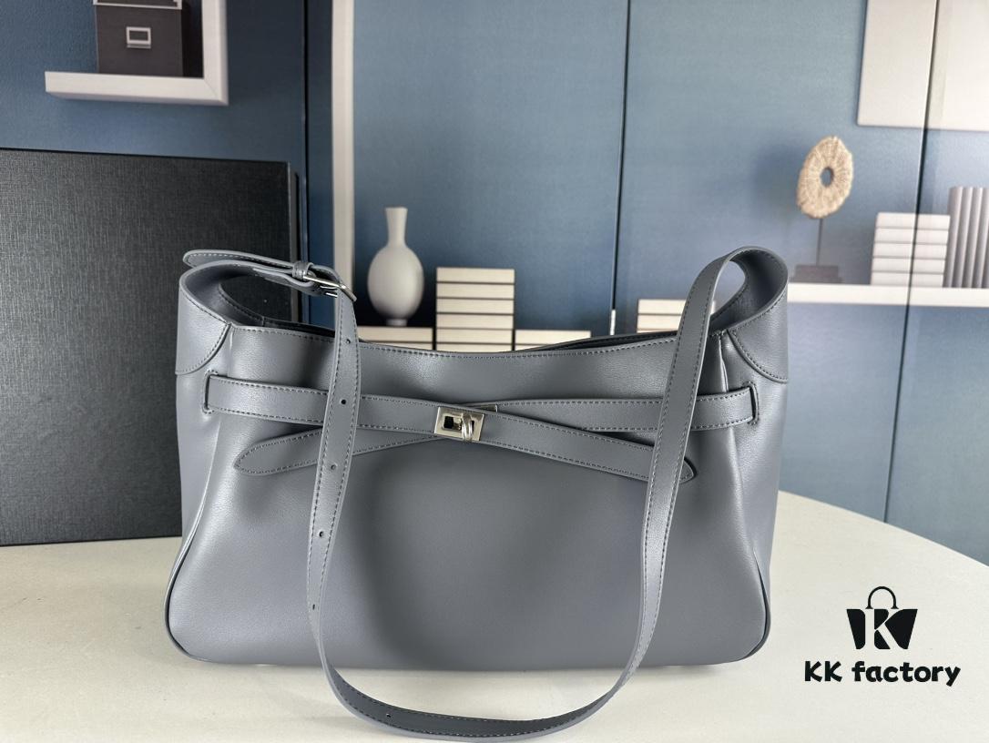 6930e1b36e68136f4d9b236c New Balenciaga Winter 24 Collection Re-See Shoulder Bucket Bag, Full-Grain Leather, Minimalist Luxury Design, Upcycled Motorbike Glove Clutch with Keychain Closure, Effortlessly Chic Look