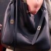 6930e22d6e68136f4d9b2414 New Balenciaga Winter 24 Collection Re-See Shoulder Bucket Bag, Top-Grain Leather, Minimalist Luxury Design, Upcycled Motorbike Glove Handbag with Keychain Closure, Effortless Chic Style