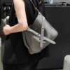 6930e22d6e68136f4d9b2415 New Balenciaga Winter 24 Collection Re-See Shoulder Bucket Bag, Top-Grain Leather, Minimalist Luxury Design, Upcycled Motorbike Glove Handbag with Keychain Closure, Effortless Chic Style