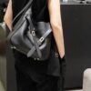 6930e22e6e68136f4d9b2416 New Balenciaga Winter 24 Collection Re-See Shoulder Bucket Bag, Top-Grain Leather, Minimalist Luxury Design, Upcycled Motorbike Glove Handbag with Keychain Closure, Effortless Chic Style