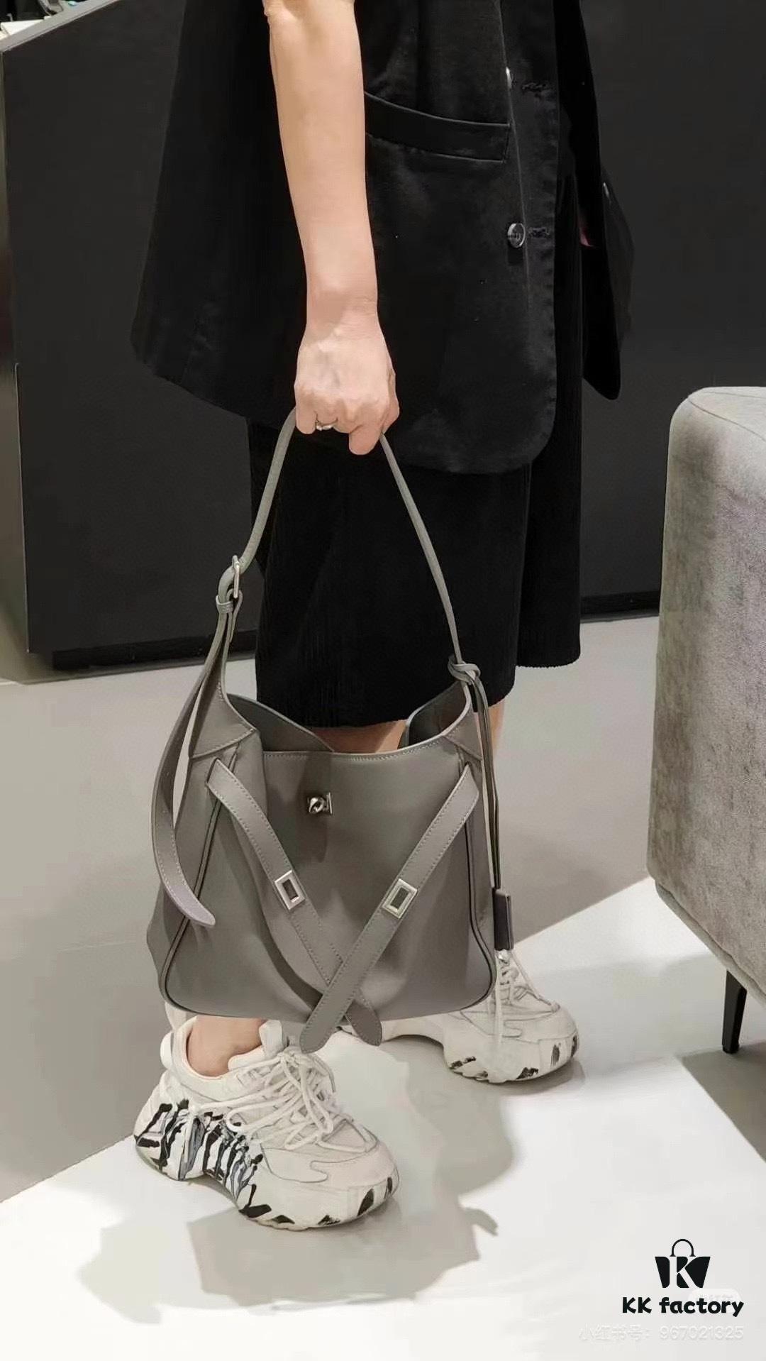 6930e22f6e68136f4d9b2418 New Balenciaga Winter 24 Collection Re-See Shoulder Bucket Bag, Top-Grain Leather, Minimalist Luxury Design, Upcycled Motorbike Glove Handbag with Keychain Closure, Effortless Chic Style
